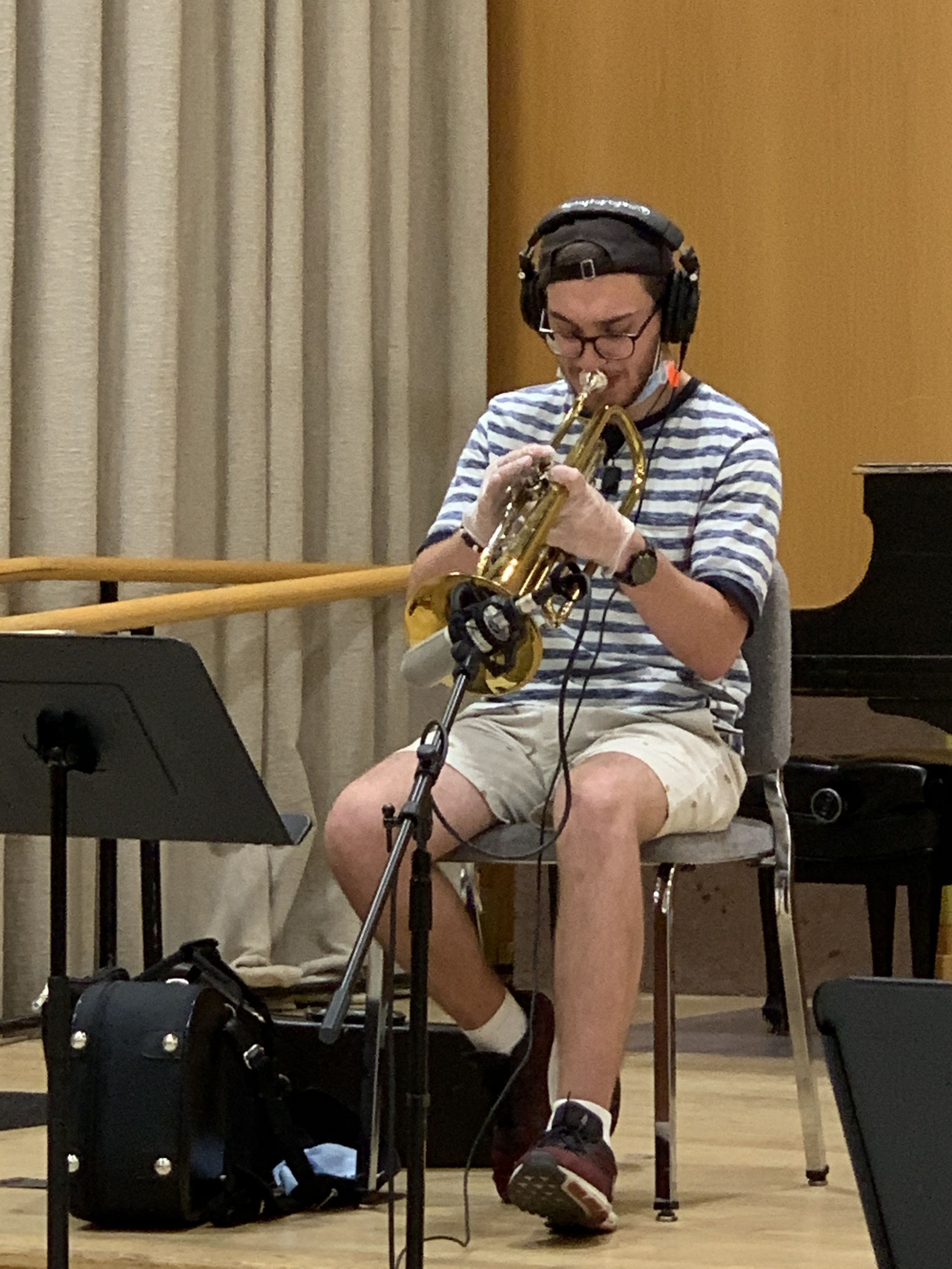 A trumpeter recording his parts for the album