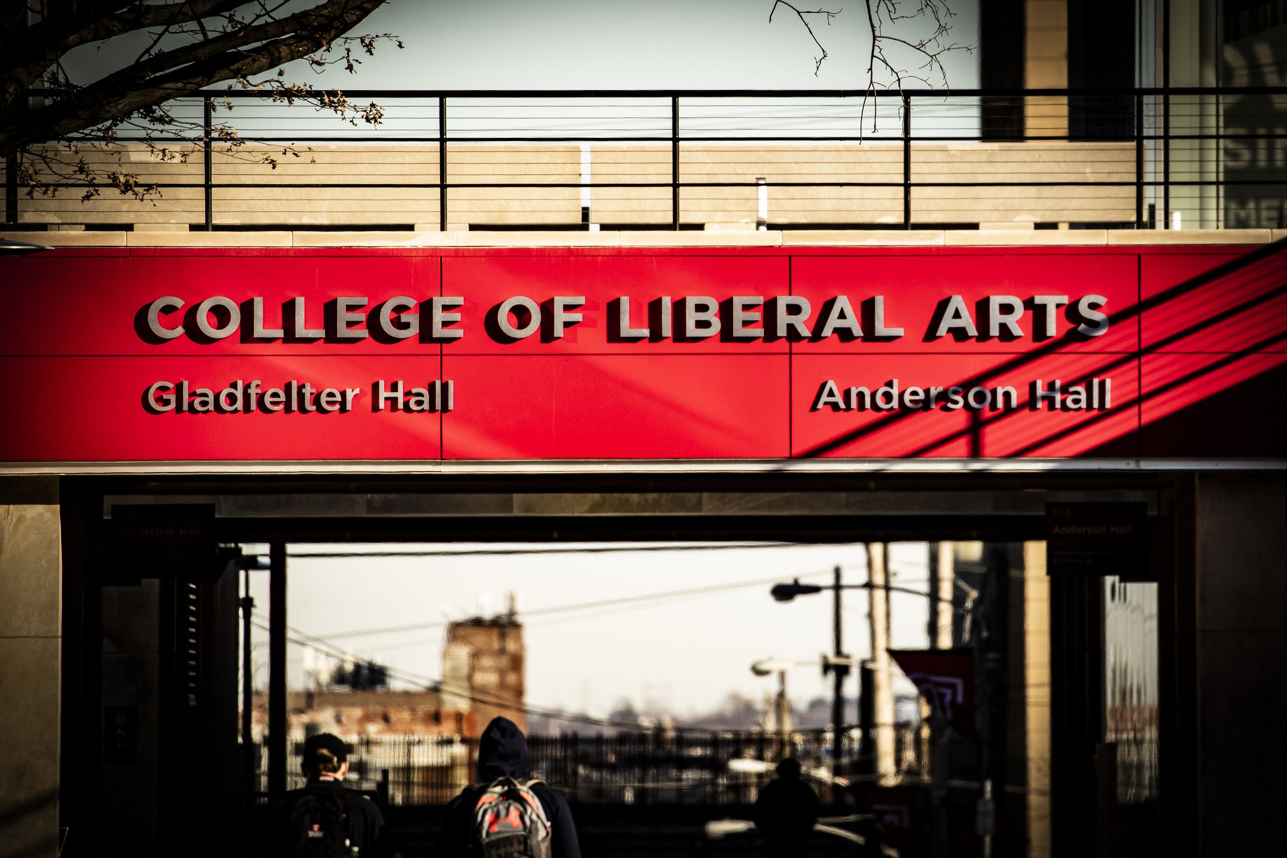 A building sign that reads, College of Liberal Arts, Gladfelter and Anderson Hall.