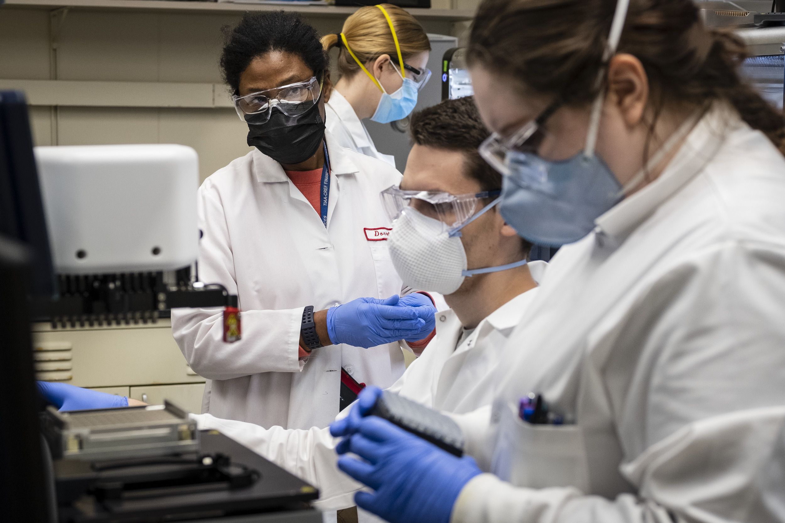 Scientists working in Temple's COVID-19 testing lab.