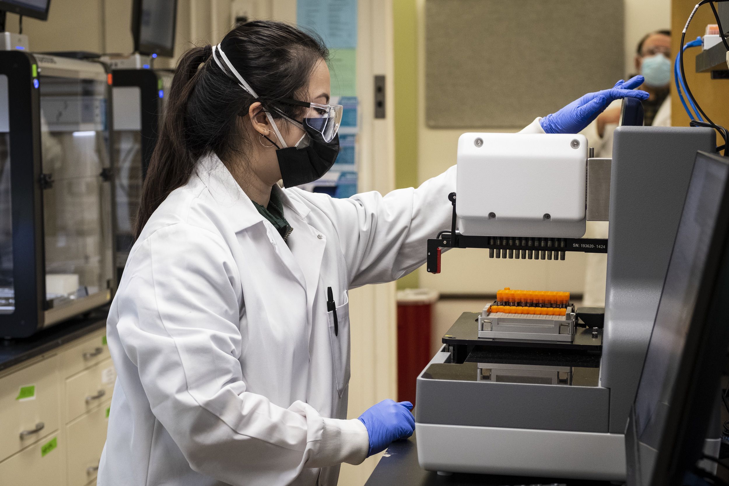 A scientist working in Temple's COVID-19 testing lab