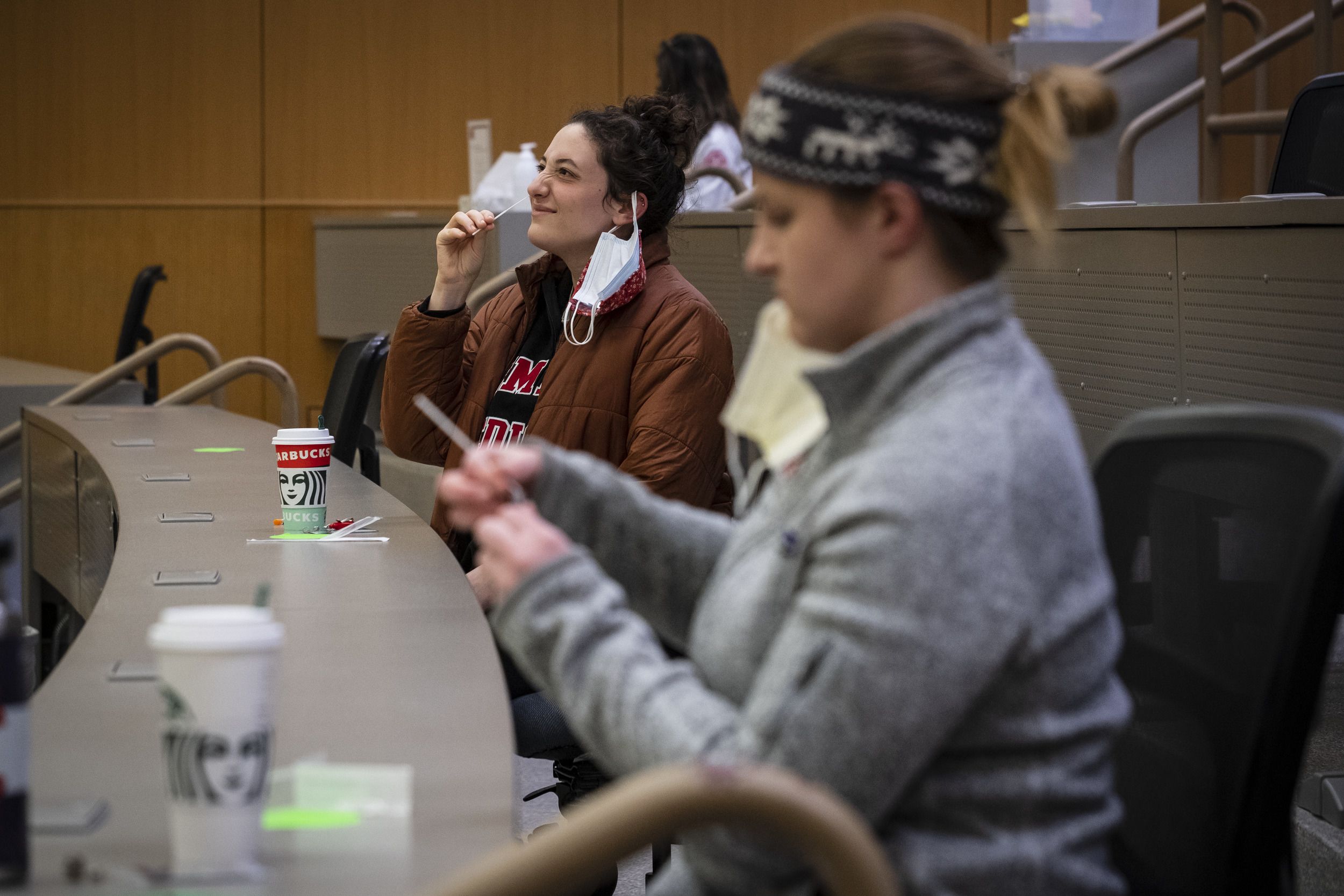A Temple student self-administers a COVID-19 test.